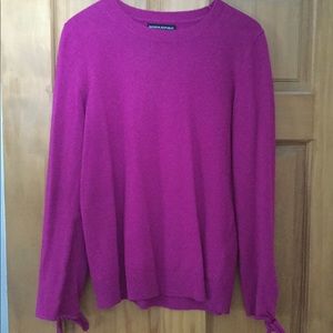 Sweater with little ties at wrists.